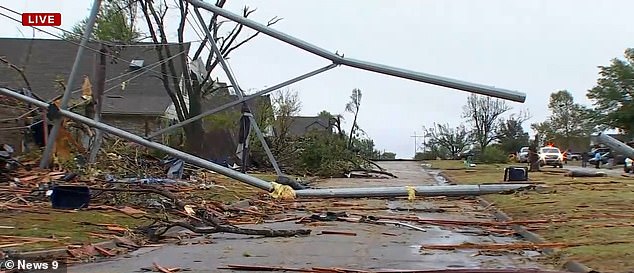 During the storm, a huge power line was downed and landed on the roof of a house