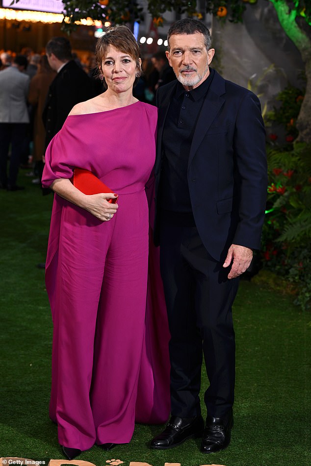 The actress, 50, stunned in a pink jumpsuit for the event in Leicester Square, where she put her arm around the actor, 64