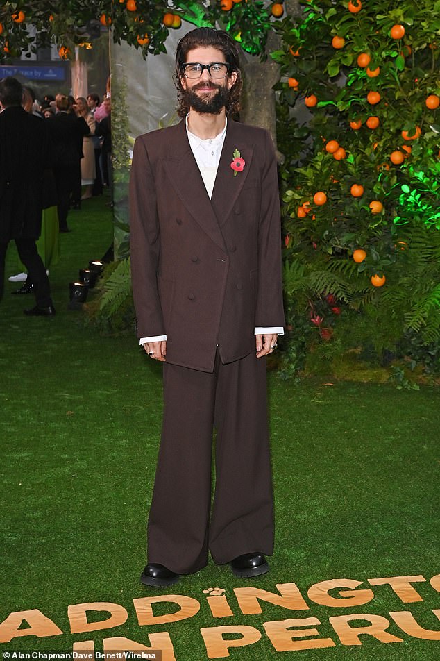 Ben Whishaw, who voices the bear himself, wore a quirky brown suit