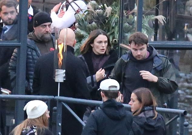 After filming, Keira wrapped up warm in a padded jacket