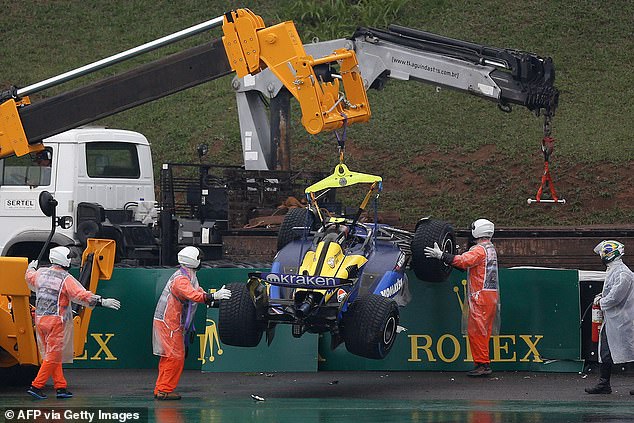 Colapinto's car was lifted and then removed from the side of the circuit by a large truck