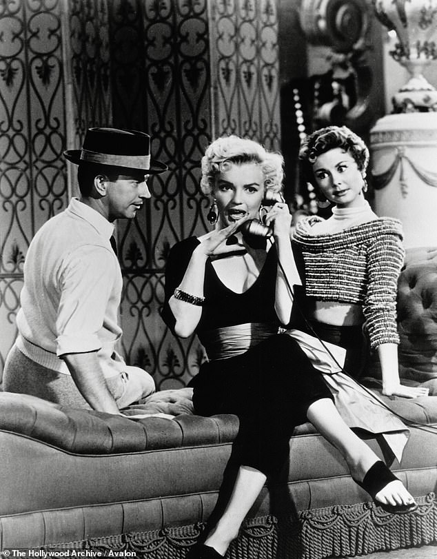 Singer Brocarde - who claims to have seen Marilyn's ghost at the pool - said: 'So many psychic mediums have told me that the Roosevelt Hotel is charged with paranormal energy.' The Siren with Donald O'Connor and Mitzi Gaynor in There No Business Like Show Business in 1954