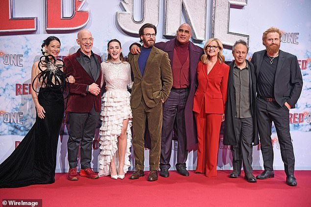 Lucy joined her fellow Red One co-stars (L-R) JK Simmons, Kiernan Shipka, Chris Evans, Dwayne Johnson, Bonnie Hunt and Kristofer Hivju and American director Jake Kasdan