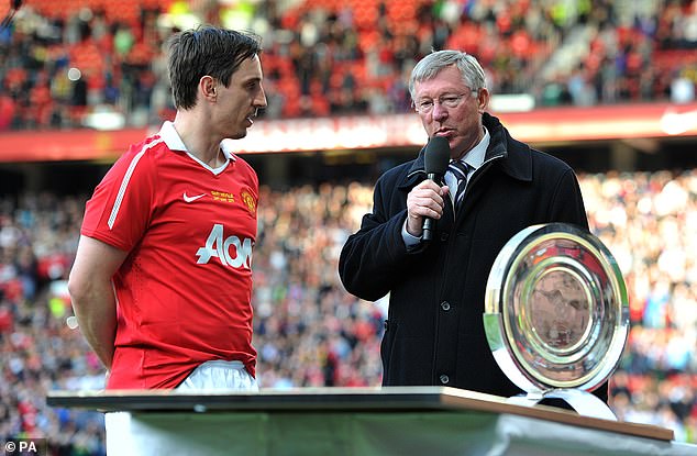 Neville pictured (left) during his playing career in 2011 alongside manager Sir Alex Ferguson