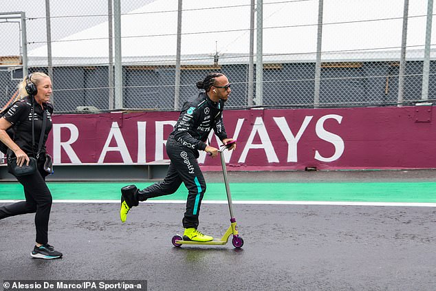 Hamilton, 39, pictured riding a scooter at the Autodromo Jose Carlos Pace