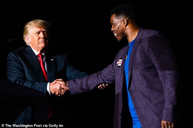 Trump and former NFL player Walker pictured together on the 2021 campaign trail