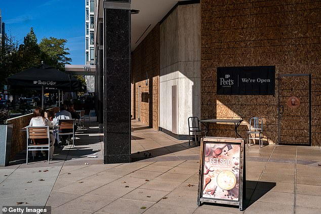 Coffee shops remain open despite the boarded-up windows