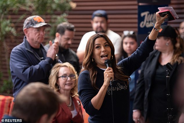 She brightened up the dark top with slim white jeans and matching sneakers. Like Jessica, the actress and filmmaker wore hoop earrings, although she opted for a thicker pair of gold earrings