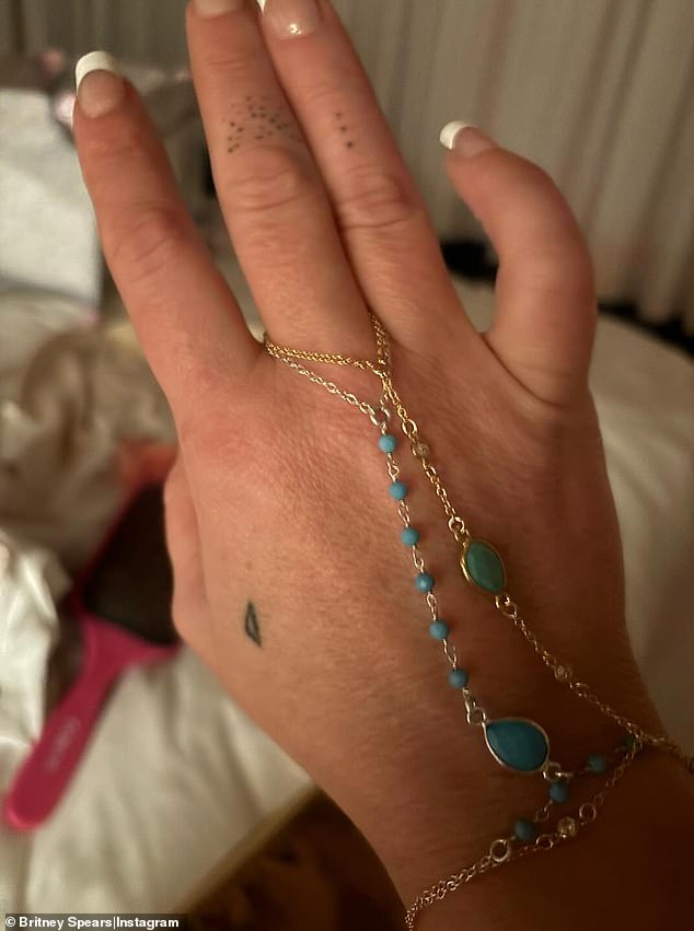 On Sunday, the starlet shared a photo of herself modeling a sample hand chain with blue and green gemstones