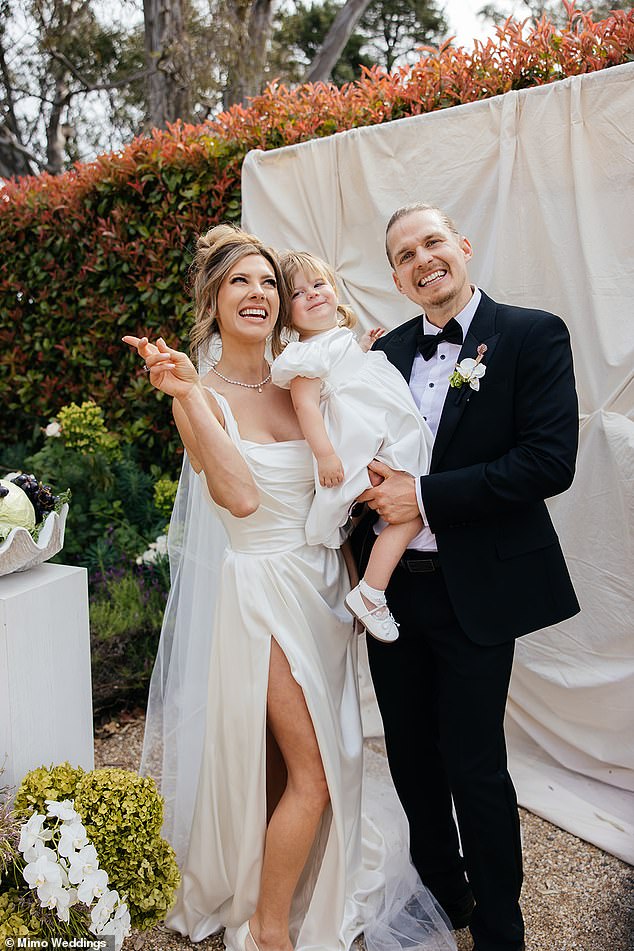 The wedding started with their adorable daughter, Remi, walking downstairs and being taken into her father's arms before Bride Mimi made her dramatic entrance.