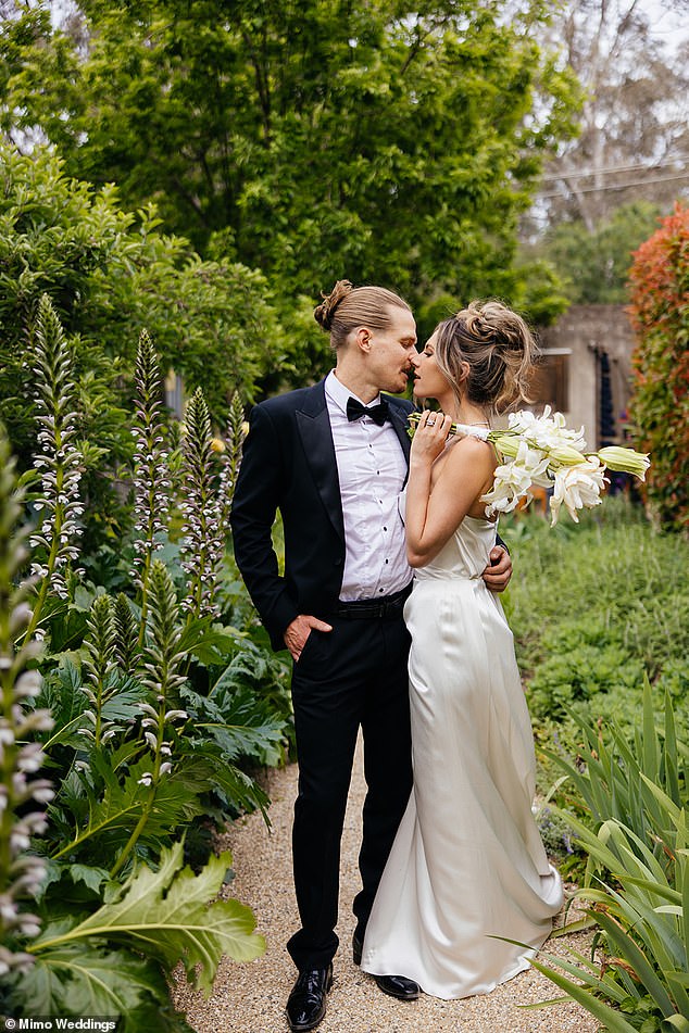 She held a bouquet of white lilies, which added a classic touch to her bridal ensemble