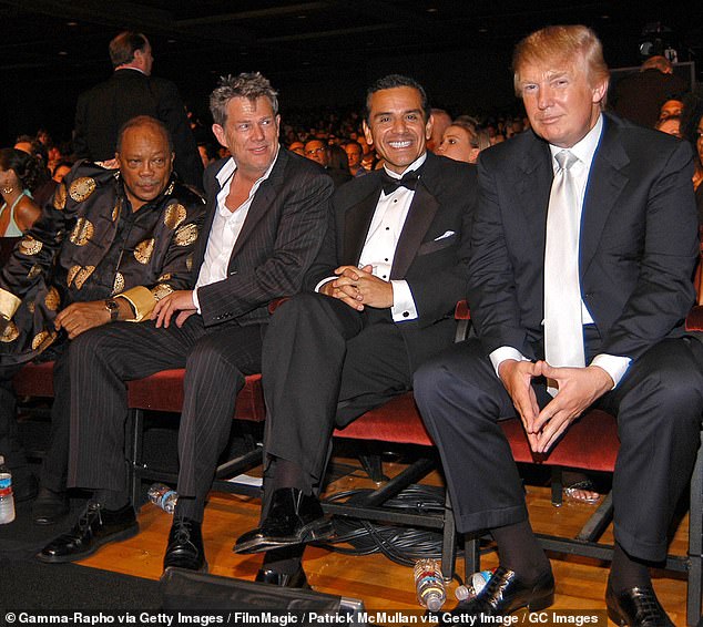 Jones (far left) pictured with Donald Trump (far right) whom he called a 