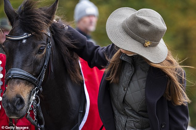 Queen Mary appeared to enjoy the horse's company as she petted the animal