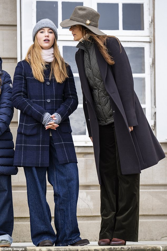 Mary was the epitome of equestrian style as she stepped out in a charcoal quilted waistcoat which she teamed with a navy blue long coat.