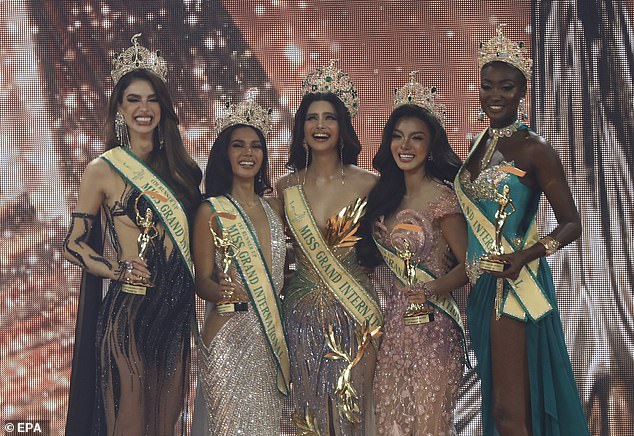 Shortly before, Miss Grand Myanmar director Htoo Ant Lwin removed the crown from Thae Su Nyein (pictured, second from right) and snatched her sash in protest.