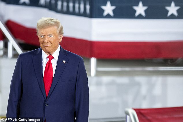 Trump arrives to speak at a campaign rally at the JS Dorton Arena in Raleigh, North Carolina, on November 4