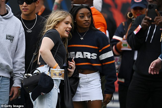 Biles is seen on the field before watching husband Jonathan Owens on September 29 in Chicago