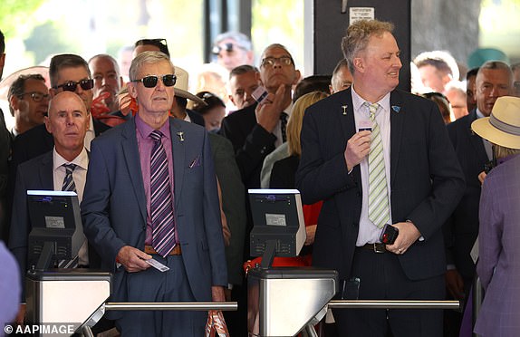 Racegoers line up to attend the 2024 Melbourne Cup at Flemington Racecourse in Melbourne, Tuesday, November 5, 2024. (AAP Image/Con Chronis) NO ARCHIVING, EDITORIAL USE ONLY