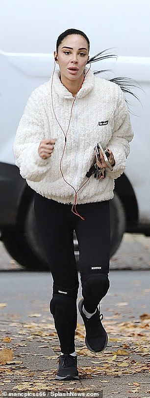 Tulisa completed the look with a pair of black trainers and appeared to be in a hurry as she ran to the salon with her headphones in.