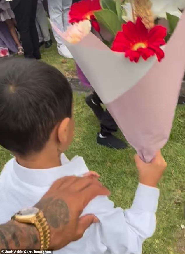 Addo-Carr posted a video of his son placing flowers on his grandmother's grave