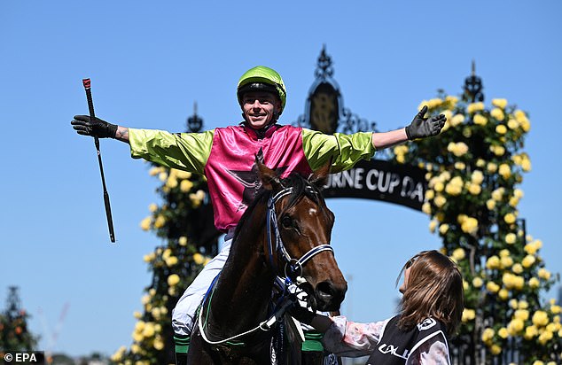 Robbie Dolan celebrates after riding Knight's Choice to victory in the 2024 Melbourne Cup at Flemington Racecourse