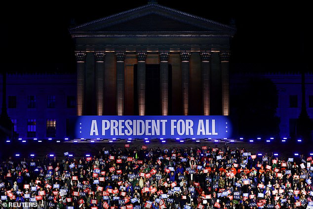 Supporters of Vice President Kamala Harris stand on the iconic 'Rocky Steps' in front of the Philadelphia Museum of Art to mark the Democratic nominee's final campaign rally before Election Day