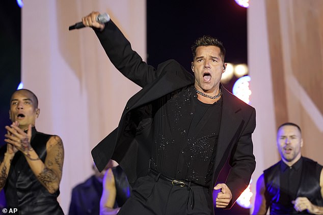 Ricky Martin shakes his hips during an appearance Monday night in Philadelphia as part of Vice President Kamala Harris' final rally before Election Day. Martin is one of a few prominent Puerto Ricans who have become more active with the Harris campaign after the rally at Madison Square Garden