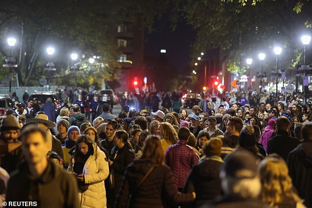 Crowds of Vice President Kamala Harris' supporters wait in line to pass through security to appear at her final rally of the 2024 presidential campaign cycle in Philadelphia Monday evening