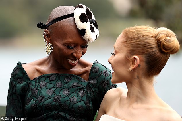 Ariana and Cynthia, who star as Glinda and Elphaba, shared some intimate smiles as they posed for photos on Tuesday