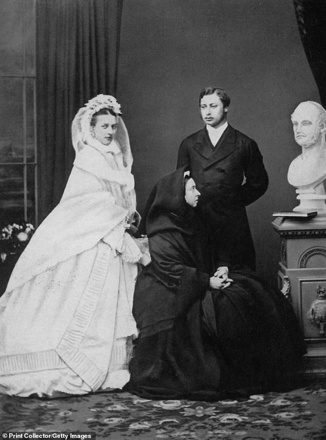 Queen Victoria with the future King Edward VII and his bride, Princess Alexandra of Denmark, on the day of their wedding in 1863