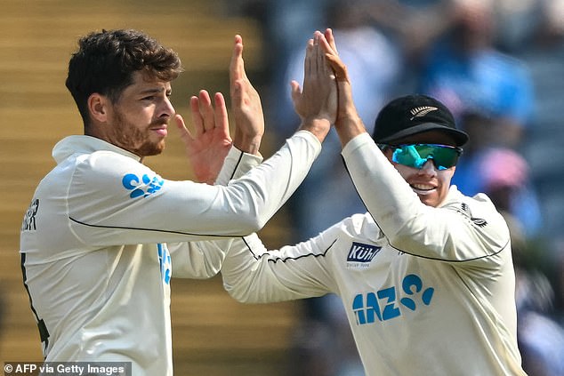 Left-arm spinner Mitchell Santner (left) was remarkably good at keeping Kohli quiet