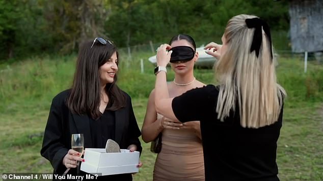 She then jokingly called the proposal team 'd**ks' after they posed as tour guides during the trip, before her now fiancé placed the beautiful diamond ring on her finger.