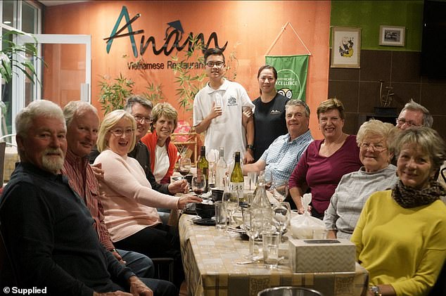 The local mayor had said the family made a 'unique contribution to the culinary landscape in Bathurst' (customers pictured with Hue and youngest son Justin standing)