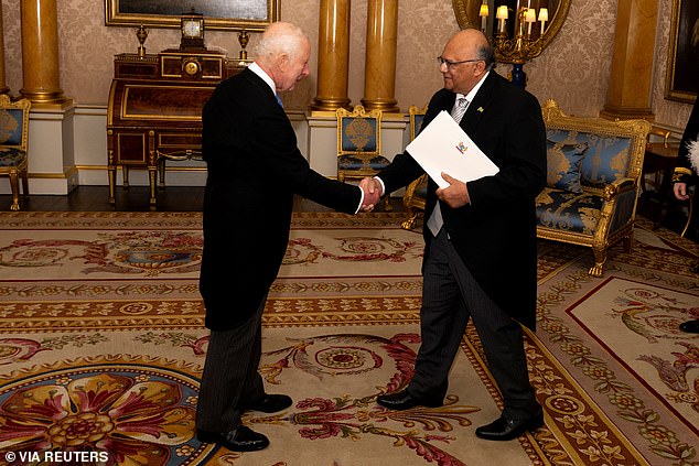 Rajendre Khargi of Suriname presents his credentials to Charles at Buckingham Palace today