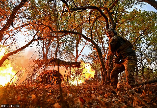 A Ukrainian military member of the Hyzhak (Predator) police special unit fires a D30 howitzer at Russian troops, amid the Russian attack on Ukraine, near the frontline city of Toretsk, Ukraine, October 25, 2024