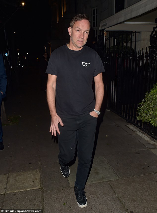 Holly's producer husband Dan opted for a casual look, wearing a graphic T-shirt, dark trousers and a pair of trainers