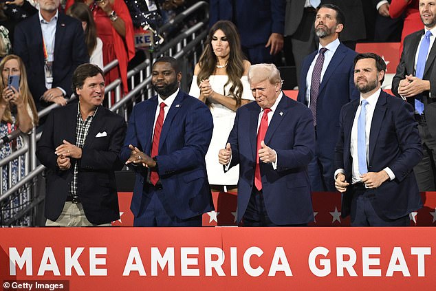 Tucker Carlson sat next to the former president at the Republican National Convention in July (pictured) and has campaigned for him across the country