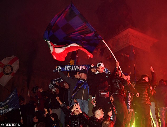 Inter fans celebrate in Piazza Duomo, one of the areas where the drinking ban applies