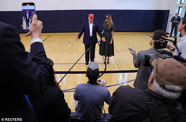 The press lined up to ask Trump questions after his vote at a local polling station