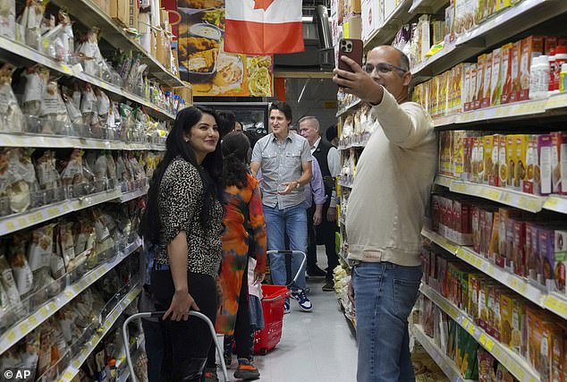 Canadian Prime Minister Justin Trudeau visits the Desi Food Mart in Cambridge, Canada, on October 6, after his government announced new measures to combat food inflation