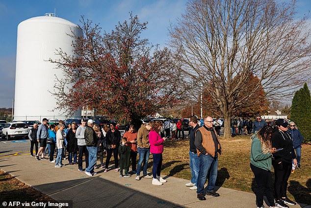 Voters line up at a polling place at Farmersville Elementary School in Easton, Pennsylvania. Pennsylvania is one of seven states expected to decide the election