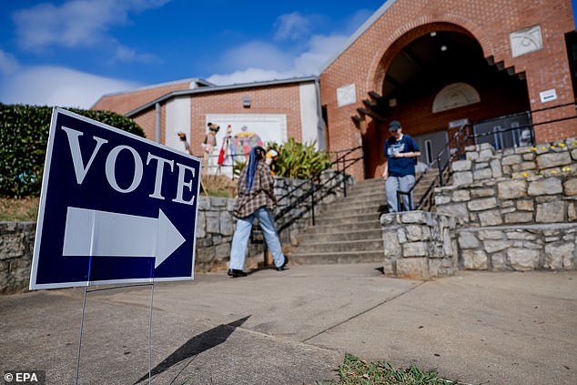 Citizens participate in early voting at a polling place in Atlanta's Dekalb County