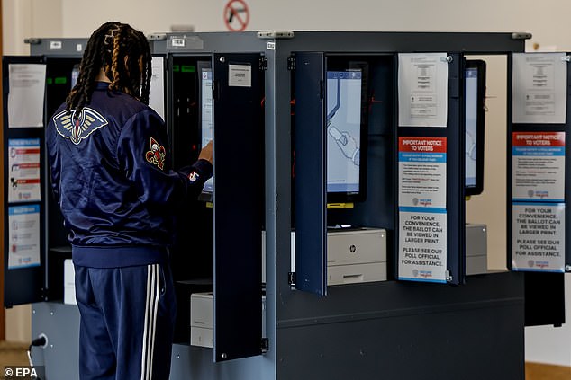 An Atlanta voter casts his ballot