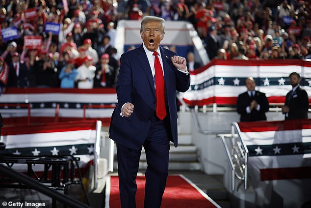 Republican presidential candidate, former President Donald Trump dances off stage at the end of a campaign rally at JS Dorton Arena on November 4, 2024 in Raleigh, North Carolina