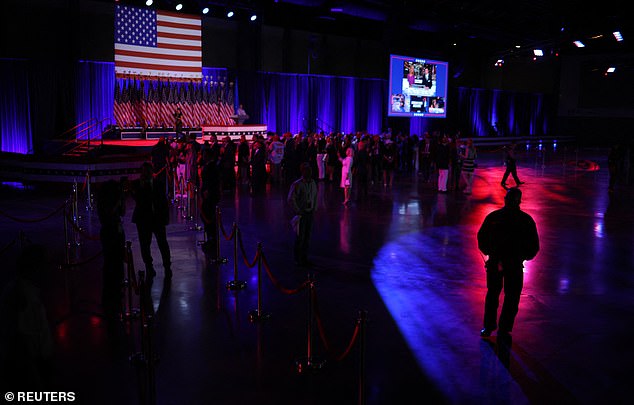 People stand in front of the Republican presidential candidate and former US President Donald Trump's waiting party at the Palm Beach County Convention Center, in West Palm Beach, Florida, USA, November 5, 2024