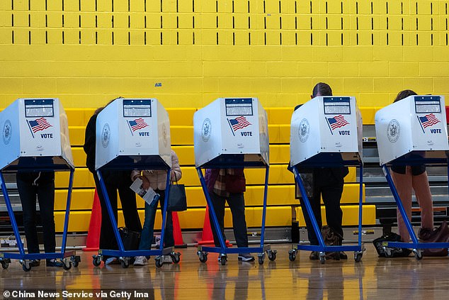 People cast their votes for the 2024 United States presidential election at a polling station on November 5, 2024 in New York City