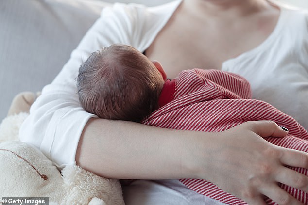 Stock photo of a young mother breastfeeding a baby boy. Breastfed children perform better on intelligence tests and are less likely to be overweight or obese later in life