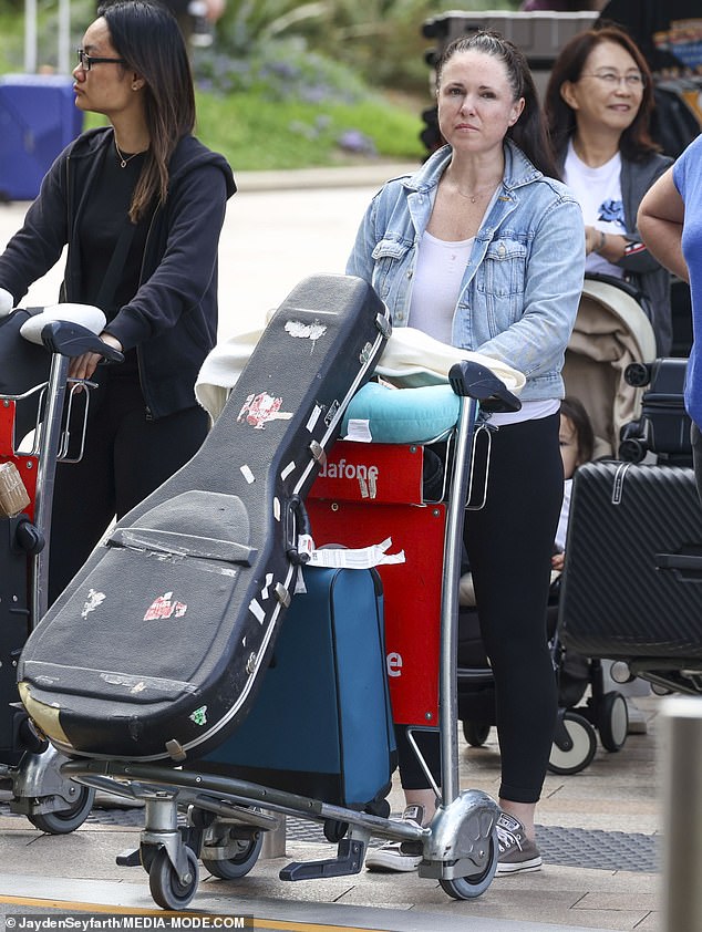 The one-hit wonder, who briefly rose to fame after the success of her song I Wish I Was A Punk Rocker in 2006, kept a low profile as she made her way through the busy arrivals hall.