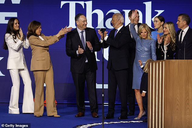 Naomi Biden (in the blue dress in the back) hid behind family members at the Democratic National Convention in August