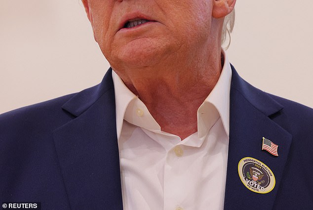 The former president wore a red MAGA hat and a button that read 